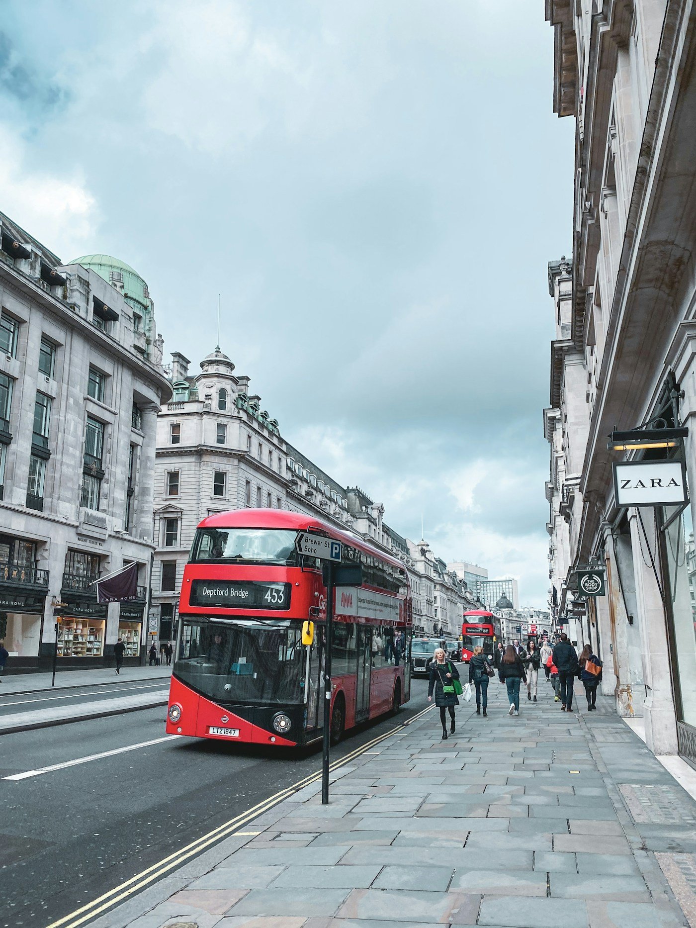 Red double-decker bus on a London street
