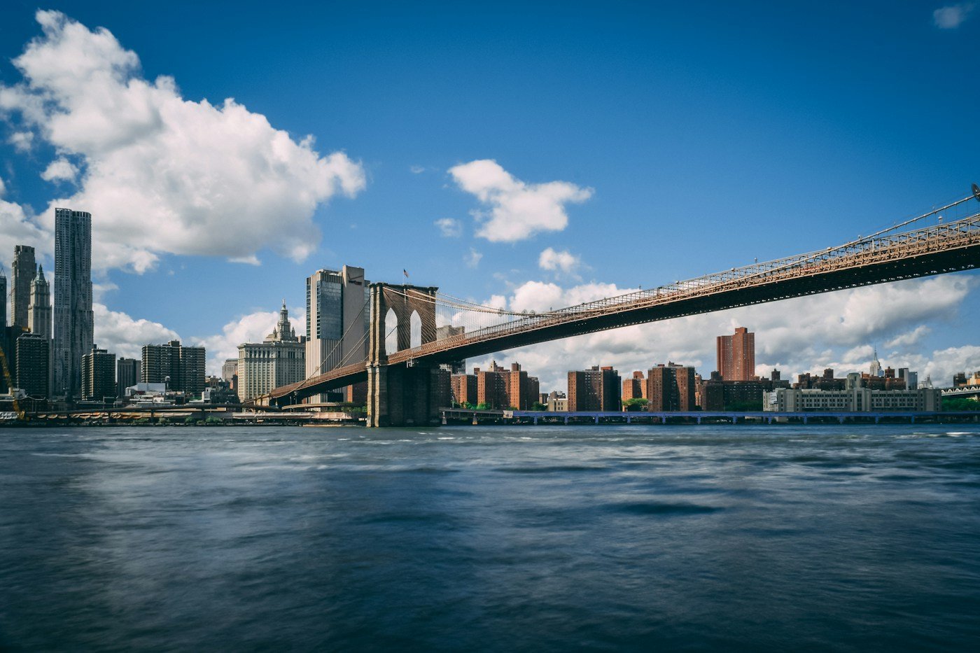 Brooklyn Bridge spanning the East River in daylight